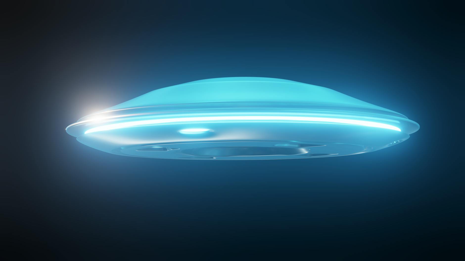 glowing with blue light flying saucer