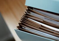 opened folder for documents on table